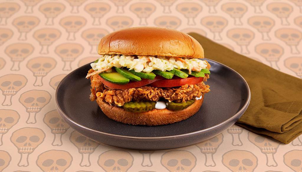 Deluxe Fried Chicken Sandwich · Crispy fried chicken breast with tomatoes, coleslaw, pickles, and ranch on a buttery brioche bun.