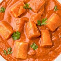 Paneer Tikka Masala · Traditional Indian paneer cheese immersed into a creamy tomato curry, served with a side of ...