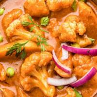 Aloo Gobi · Tender cauliflower  prepared with fresh traditional spices and served in a savory sauce with...