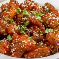Manchurian · Tender marinated chicken or cauliflower prepared with fresh spices and tossed in savory manc...