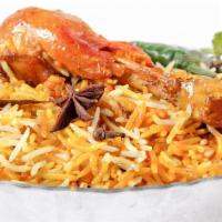 Chicken Biryani · Fresh basmati rice loaded with hearty chicken and traditional spices with a side of raita yo...