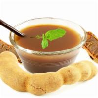 Tamarind Chutney  · Traditional sweet and tangy dipping sauce.