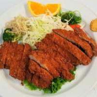 Tonkatsu · Deep fried pork breaded cutlet. Comes with salad and rice.