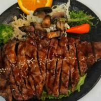 Prime Rib-Eye Teriyaki · Prime rib-eye steak with teriyaki sauce. Comes with salad and rice.