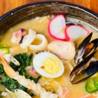Spicy Seafood Gomoku Ramen · Spicy sauce in pork broth with assorted seafood(salmon,shrimp,clam,mussel,more..),roasted po...
