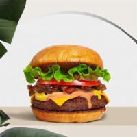 Primetime Classic Burger (Vegan) · Seasoned vegan burger patty topped with lettuce, tomato, onion, and pickles.