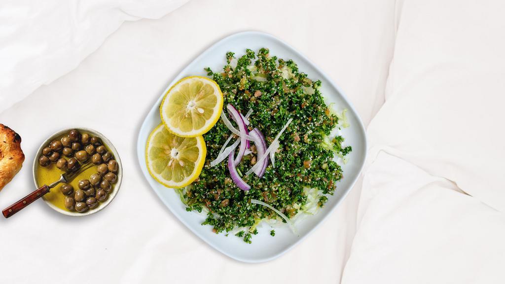 Tabouleh Out To Play Salad · Vegetarian salad made out of parsley, tomatoes, mint, onions, and olive oil, and lemon juice.