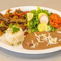 Fajitas · Steak or chicken sautéed with onions & bell peppers.