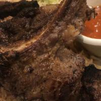 Lamb Chops · Four juicy pieces of bone in lamb, charbroiled to perfection.
