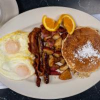 Franklin’s Combo Breakfast · Two eggs any style, two sausages, two strips of bacon, and two pancakes with home fries.