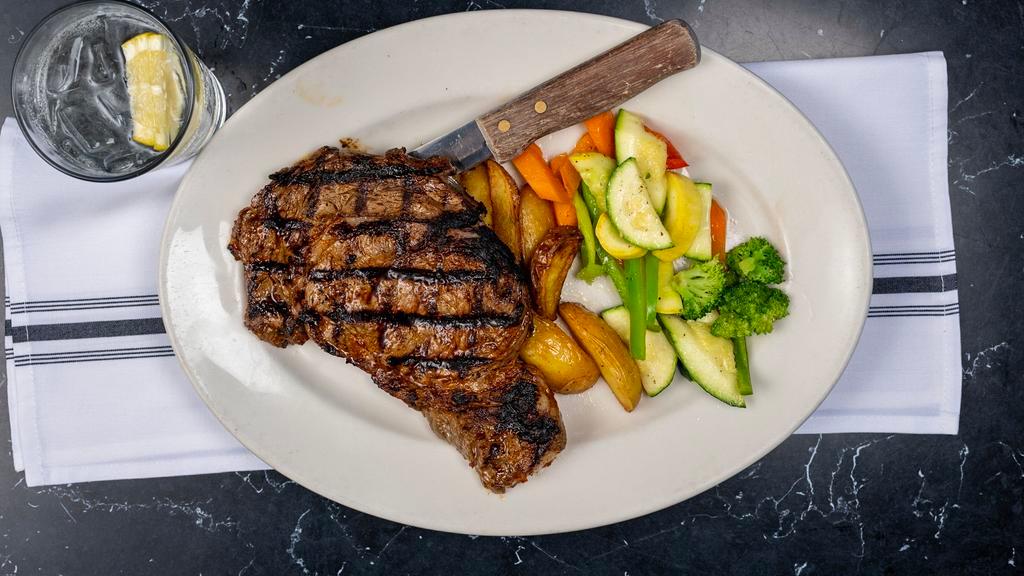 Mediterranean Rib Eye Steak · Marinated in Mediterranean spices and broiled to perfection – served with vegetable and roasted potatoes.
