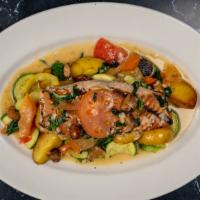 Grilled Salmon · Topped with roasted garlic, fresh tomatoes, and basil – tossed in a lemon-butter white wine ...