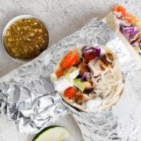 Chicken Gyro Burrito · Flavorful chicken gyro with shredded cabbage, diced tomatoes, cilantro, and tzatziki or tahi...