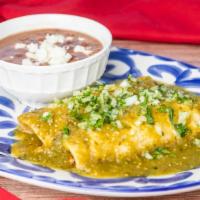 Chicken Enchiladas · Red or green salsa, queso fresco, sour cream, onions, cilantro, served with rice or beans.