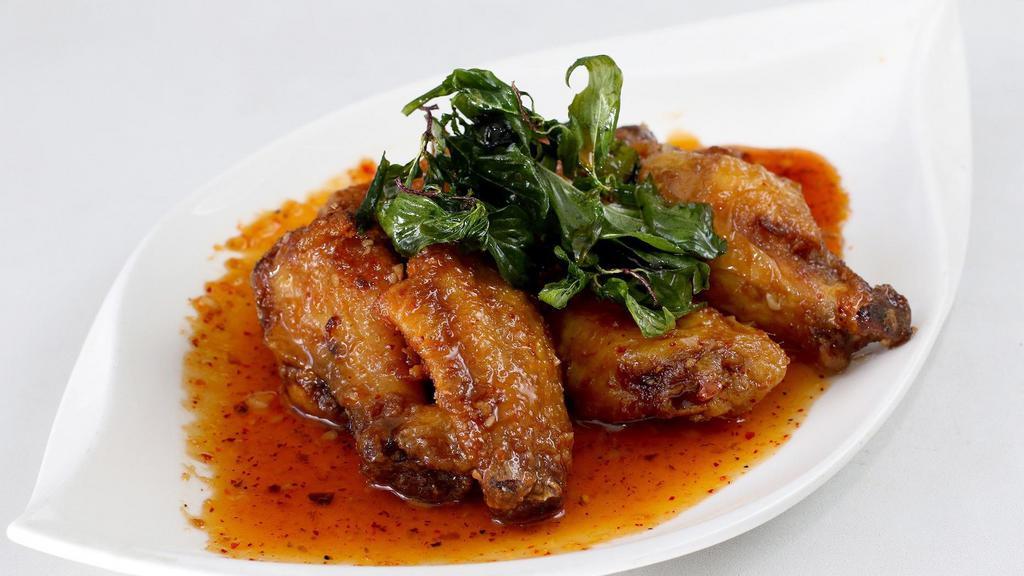 Chicken Wings · Chef’s spicy, sweet, sour garlic sauce, and crispy basil.