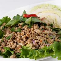 Larb Salad · Choice of minced pork, beef, chicken, or tofu; chili, onions, roasted rice powder in a lime ...