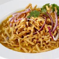 Kao Soy · Egg noodles topped with yellow curry, chicken or tofu, pickled mustard greens, red and crisp...