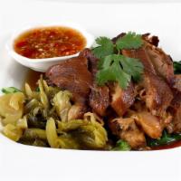 Pork Leg Stew · Braised pork, served with pickled cabbage and a spicy garlic chili sauce.