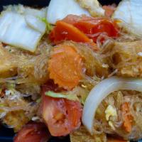 Pad Woon Sen · Pan fried silver noodles, onions, tomatoes, cabbage, carrots, garlic, and eggs.