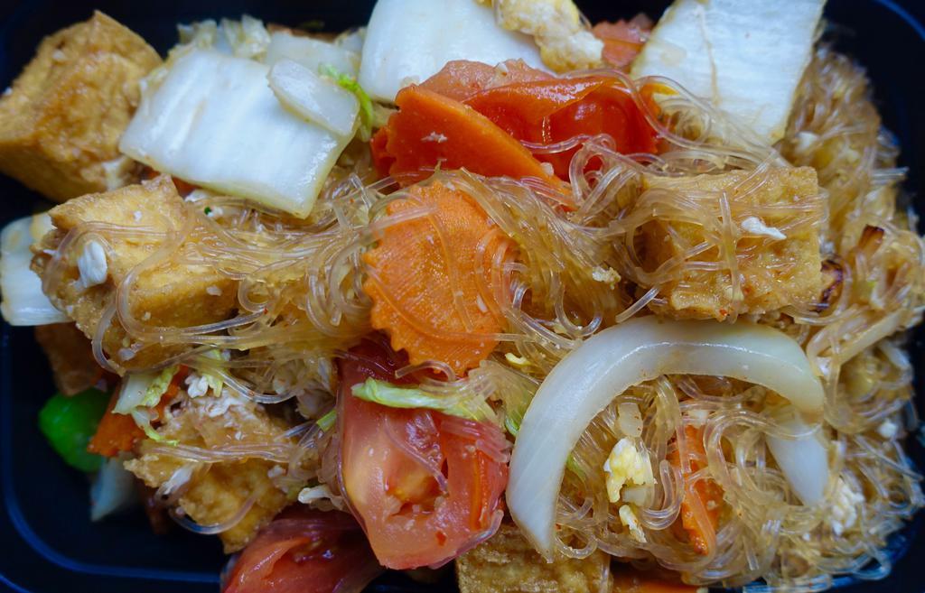 Pad Woon Sen · Pan fried silver noodles, onions, tomatoes, cabbage, carrots, garlic, and eggs.