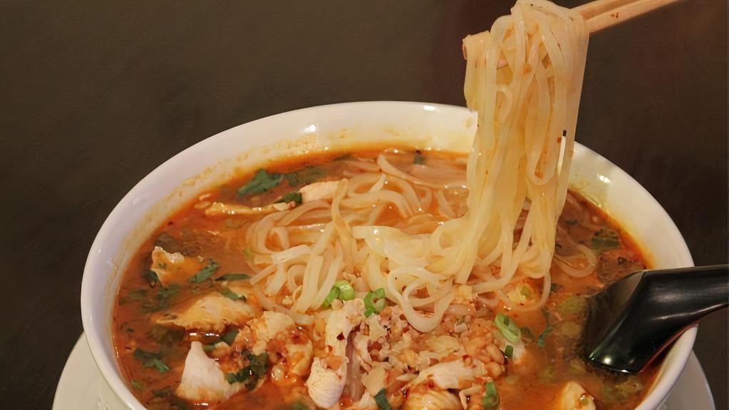 Tom Yum Noodle Soup · Hot and sour noodle soup with ground pork, sliced pork, and peanuts.