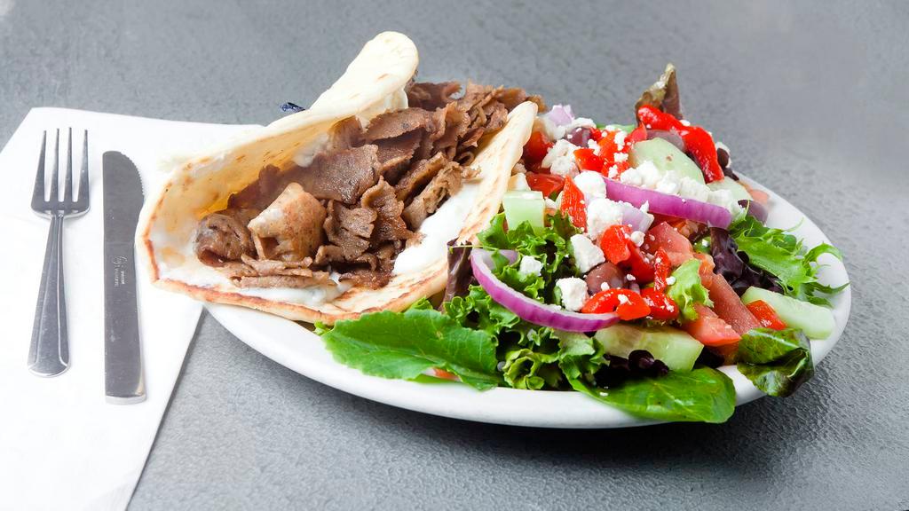 Gyro · lamb and beef gyro with taziki sauce on pita bread with greek salad