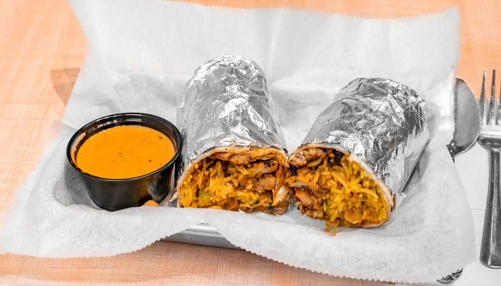 Burrito Wrap · A flour tortilla filled w/ grilled chicken or paneer, rice, chopped salad, and your choice of tikka or madras dipping sauce. 

[Nut-Free, Egg-Free; Vegetarian and Vegan options available]