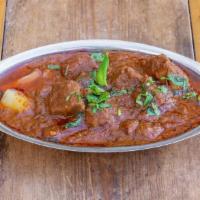 Lamb Gosht (Lamb Stew) · Slow braised, grass-fed Australian lamb and potatoes in a rich, aromatic gravy of caramelize...