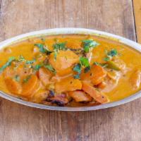 Madras Chicken Curry Ala Carte · A hearty bowl of boneless chicken, carrots, potatoes, & peas cooked in Madras curry spices a...