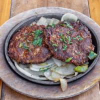Beef Chapli Kabab Sizzler · (2pcs) From Peshawari kabab houses to your plate: distinctly spiced minced beef kabab pattie...
