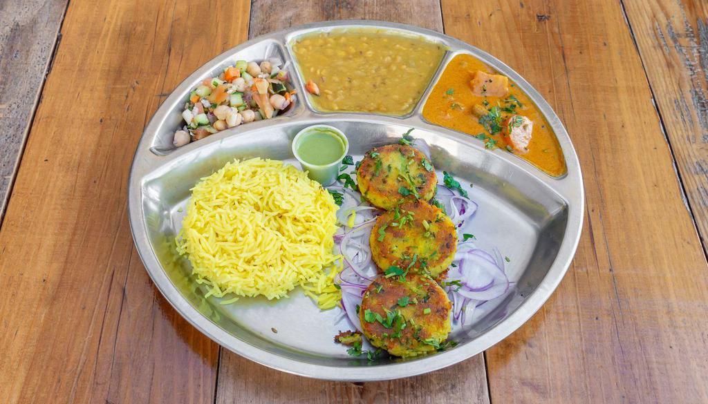 Aloo Tikki (Potato Cutlet) Thali · Meal includes Rice, Daal Lentil, and Chopped Pickled Salad with Tamarind Chutney. Spiced Potato Cutlets & a side of Madras curry. <br /><br />[Nut-Free, Vegan]
