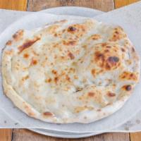 Garlic Naan · Handmade to order in our clay oven. 

[Contains Egg, Gluten and Dairy. Nut-Free]