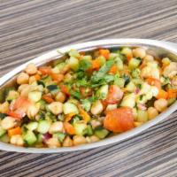 Chopped Salad 8 Ounces · Garbanzo beans, carrots, tomato, cucumber, and a sprinkle of cilantro. This pickled salad pa...