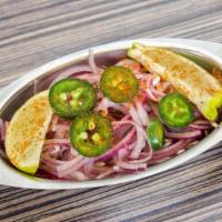 Piyaaz Salad 8 Ounces · Raw red onions, chopped Jalapeños and lime wedges with a sprinkle of our home-made chaat mas...