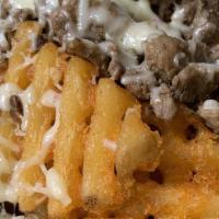 Waffle Fries · Choice of meat, potato, sour cream, guacamole, cheese and pico de gallo.