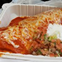 Wet Burrito · Rice and beans, pico de gallo, guacamole, cheese sour cream, choice of meat and red sauce on...