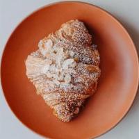 FRANGIPANE CROISSANT · twice baked croissant with almond cream and brandy | (n)