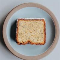 LEMON POPPYSEED TEA CAKE SLICE · this item contains nuts*