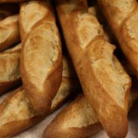 Baguette · Hand folded baguette dough, bake to crisp golden crust.