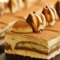 Tiramisu · One layer of Italian espresso and myers rum infused lady fingers, one layer of chocolate chi...