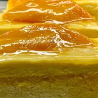 Mango Mousse · Two layers of mango infused champagne white chiffon cake, two layers of mango mousse, topped...
