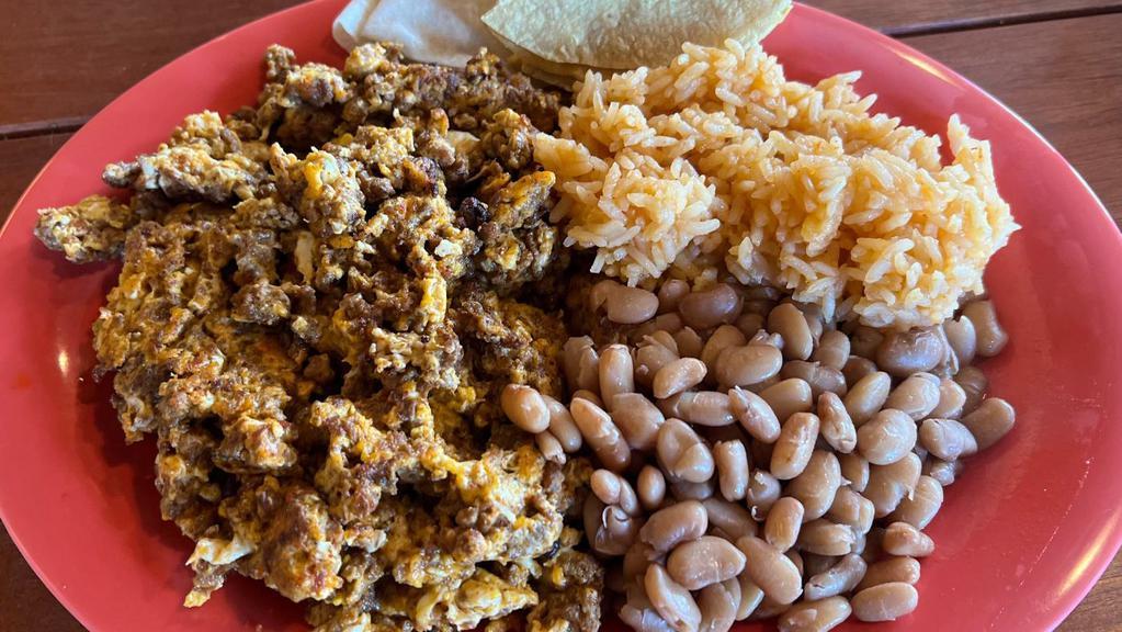 Huevos con Chorizo (Mexican Sausage) · Burrito or plate,  (scramble eggs with Mexican Sausage) served with your choice of rice and beans.