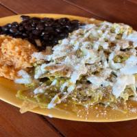 Chilaquiles Verde · Sliced crispy corn tortillas, mixed with egg and cooked in a tasty green sauce topped with o...