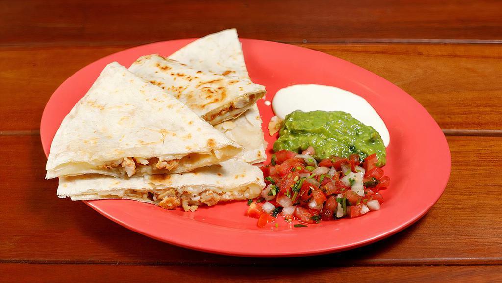 Quesadilla Meat · Quesadilla with your choice of meat, Includes sour cream, guacamole and salsa fresca on the side.