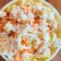 Esquites (Street Corn) · White corn mixed in a creamy epazote sauce and lime, topped with Mexican dried chile powder,...