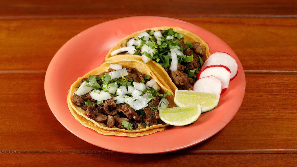 Soft Street Taco · Choice of meat, cilantro, onion, radishes, and lemon on the side, served on a corn tortilla.