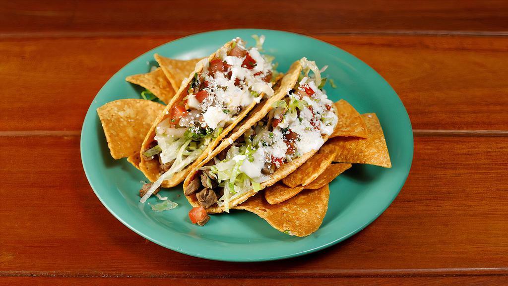 Crispy Taco (1) · Choice of meat, topped with lettuce, Mexican cheese, tomato sauce, sour cream and salsa fresca.