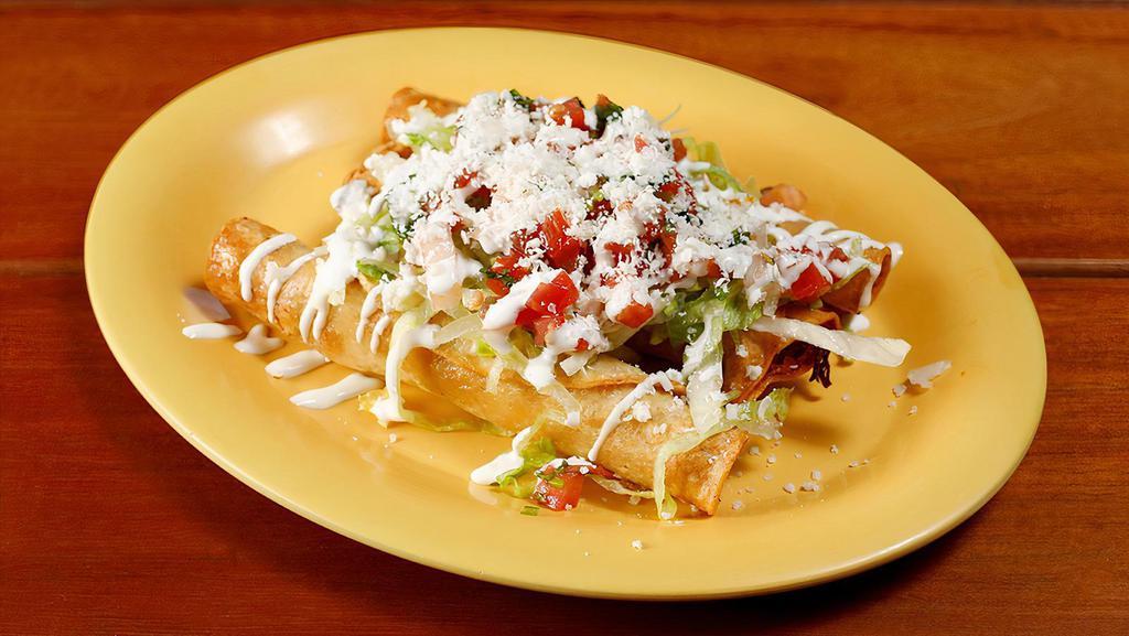 Taquitos · Three crisp corn tortillas filled with chicken or  beef topped with lettuce, Mexican cheese, sour cream, and salsa fresca.