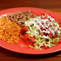 Meat Enchilada (1) · Hand rolled corn tortillas in a red or green sauce filled with your choice of meat and toppe...