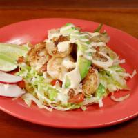 Shrimp Taco · Grilled shrimp marinated in garlic, served on a corn tortilla topped with lettuce, salsa fre...